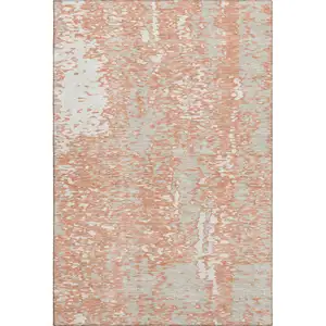 Photo of Coral Taupe And Ivory Abstract Washable Area Rug With UV Protection