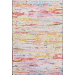 Photo of Coral Yellow And Ivory Abstract Washable Area Rug With UV Protection