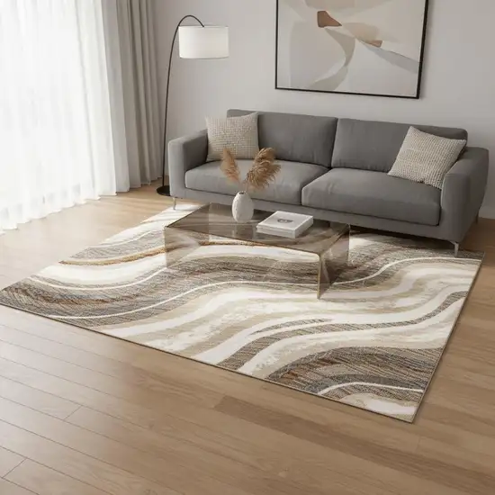 Cream And Beige Abstract Area Rug Photo 1