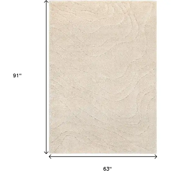 Cream And Beige Abstract Area Rug Photo 3