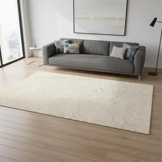 Cream And Beige Abstract Area Rug Photo 1