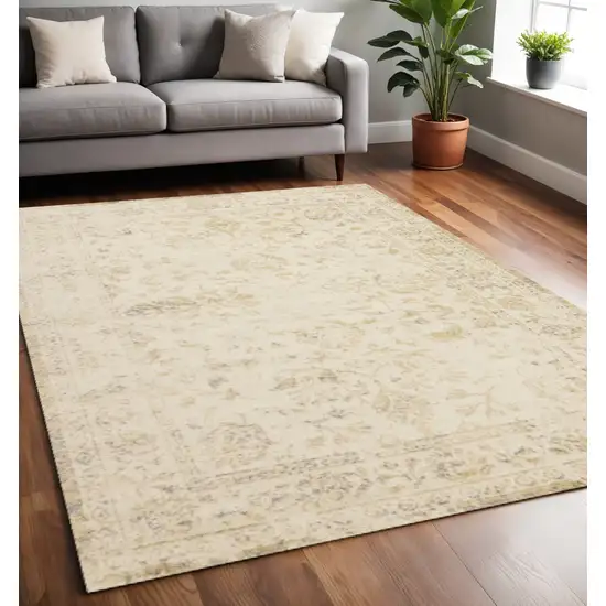 Cream And Beige Abstract Area Rug Photo 1