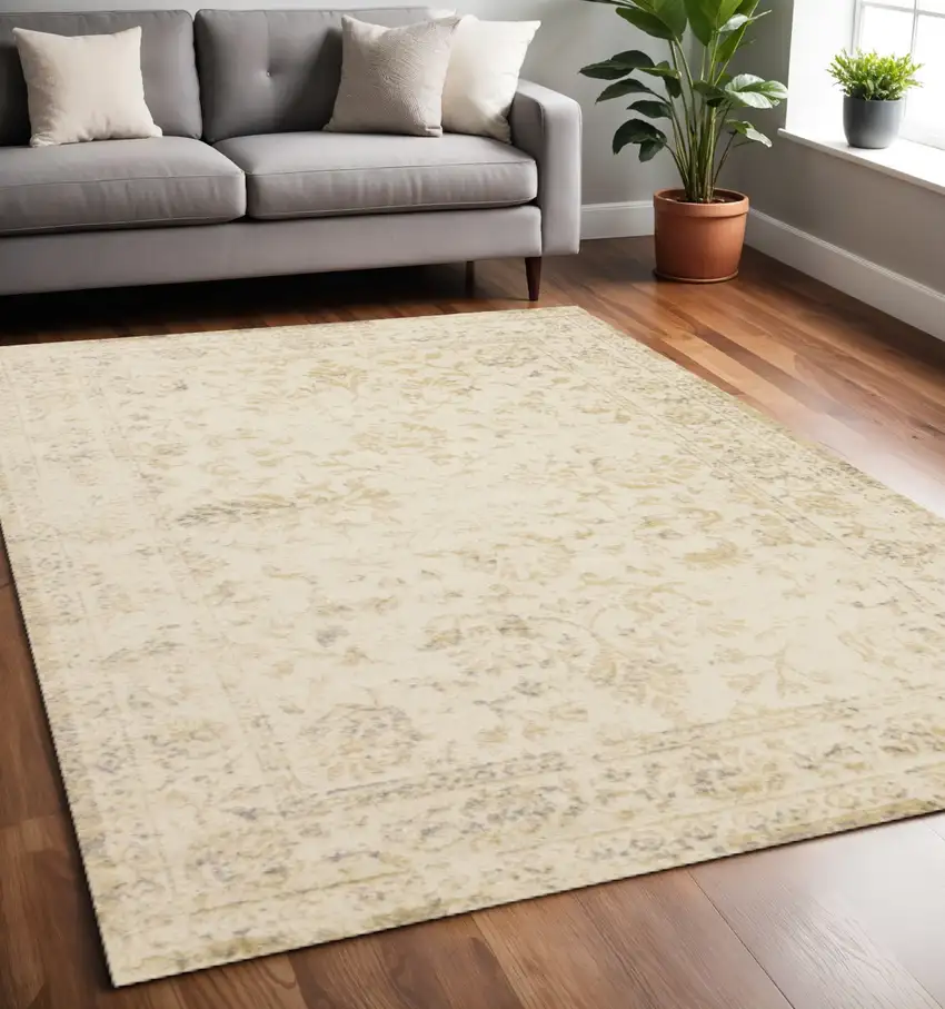 Cream And Beige Abstract Area Rug Photo 1