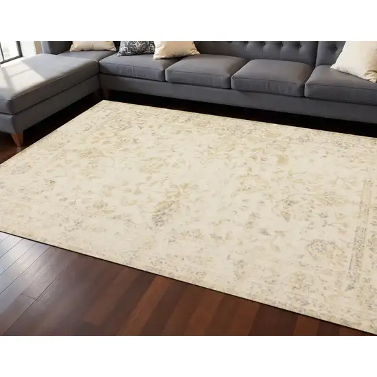 Cream And Beige Abstract Area Rug Photo 1