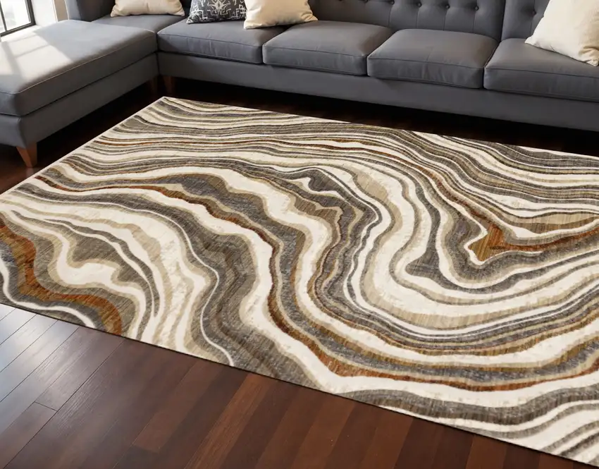 Cream And Beige Abstract Area Rug Photo 1