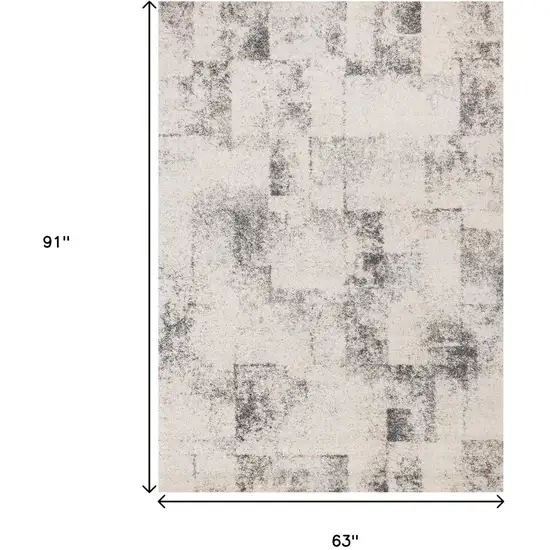 Cream And Black Abstract Area Rug Photo 3