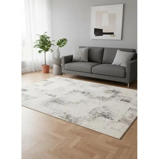 Cream And Black Abstract Area Rug Photo 1
