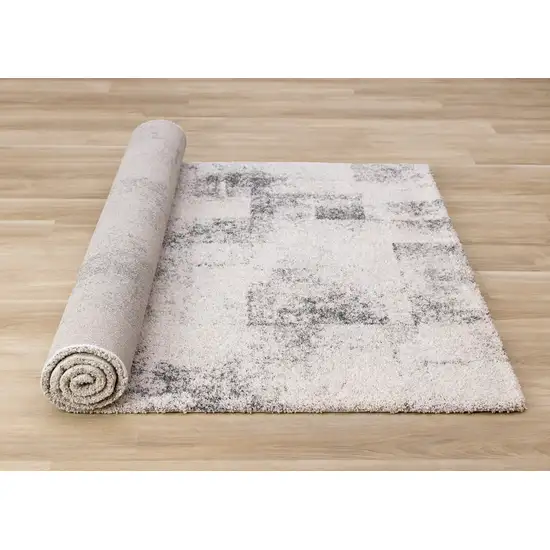 Cream And Black Abstract Area Rug Photo 9