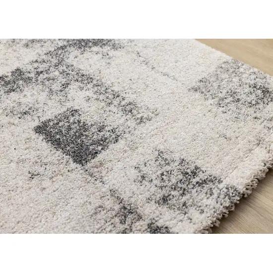 Cream And Black Abstract Area Rug Photo 6