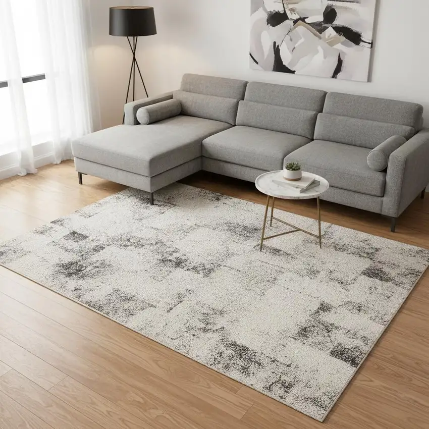 Cream And Black Abstract Area Rug Photo 1