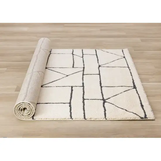 Cream And Black Geometric Area Rug Photo 9