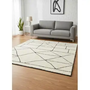 Photo of Cream And Black Geometric Area Rug