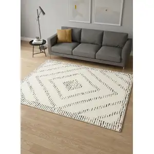Photo of Cream And Black Geometric Area Rug
