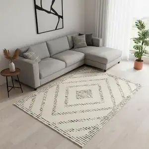 Photo of Cream And Black Geometric Area Rug