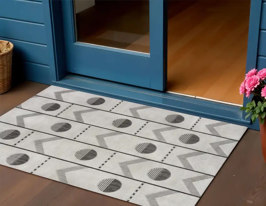 Cream And Black Geometric Indoor Outdoor Area Rug Photo 1