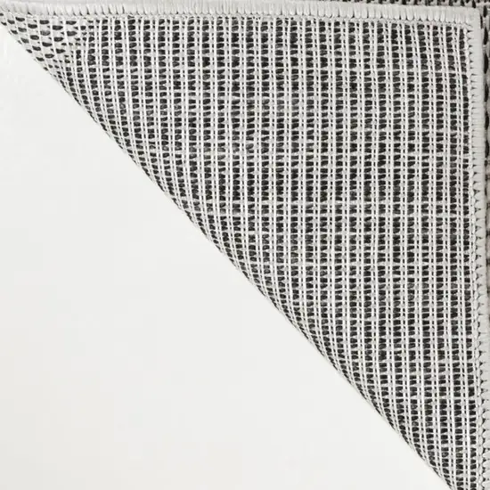 Cream And Black Geometric Indoor Outdoor Area Rug Photo 1