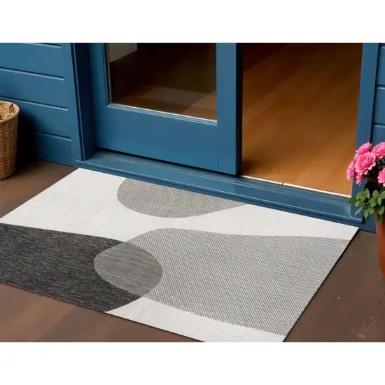 Cream And Black Geometric Indoor Outdoor Area Rug Photo 1