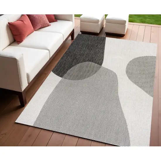 Cream And Black Geometric Indoor Outdoor Area Rug Photo 1