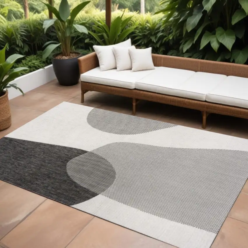 Cream And Black Geometric Indoor Outdoor Area Rug Photo 1