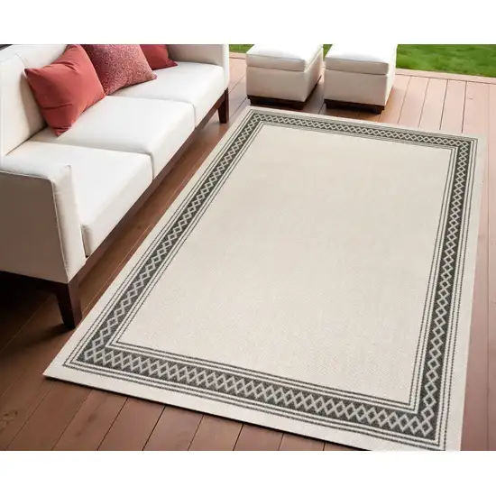 Cream And Black Indoor Outdoor Area Rug Photo 1