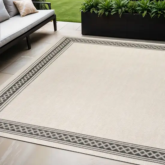 Cream And Black Indoor Outdoor Area Rug Photo 1