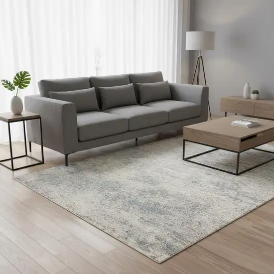 Cream And Blue Abstract Area Rug Photo 1