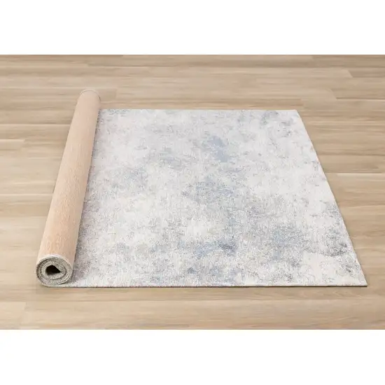 Cream And Blue Abstract Area Rug Photo 9