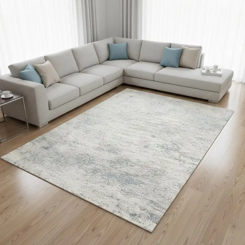 Cream And Blue Abstract Area Rug Photo 1