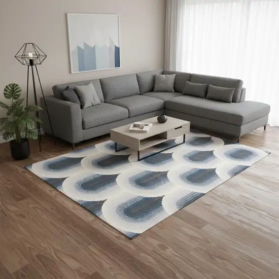 Cream And Blue Geometric Area Rug Photo 1