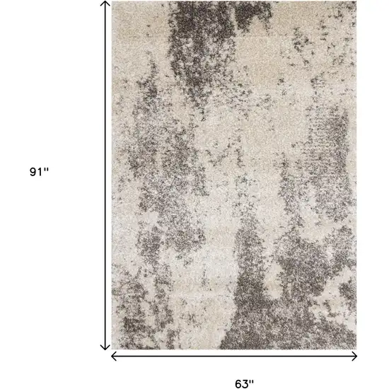Cream And Brown Abstract Area Rug Photo 3