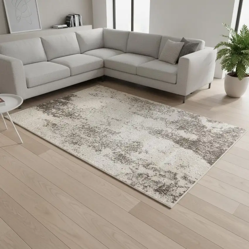 Cream And Brown Abstract Area Rug Photo 1