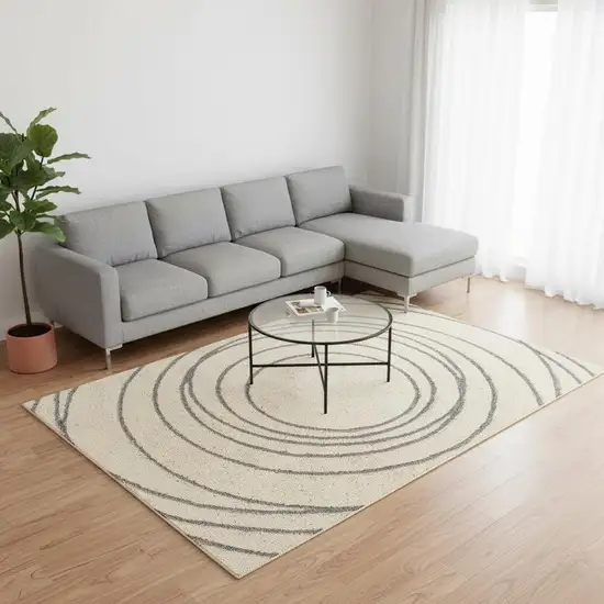 Cream And Gray Abstract Area Rug Photo 1