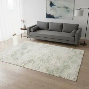 Photo of Cream And Green Abstract Area Rug