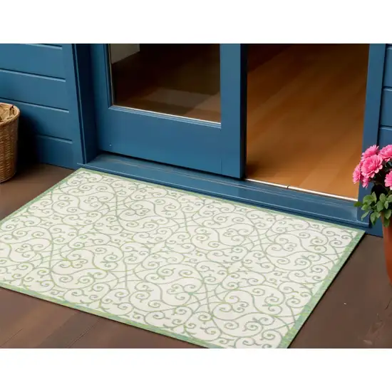 Cream And Green Geometric Indoor Outdoor Area Rug Photo 1