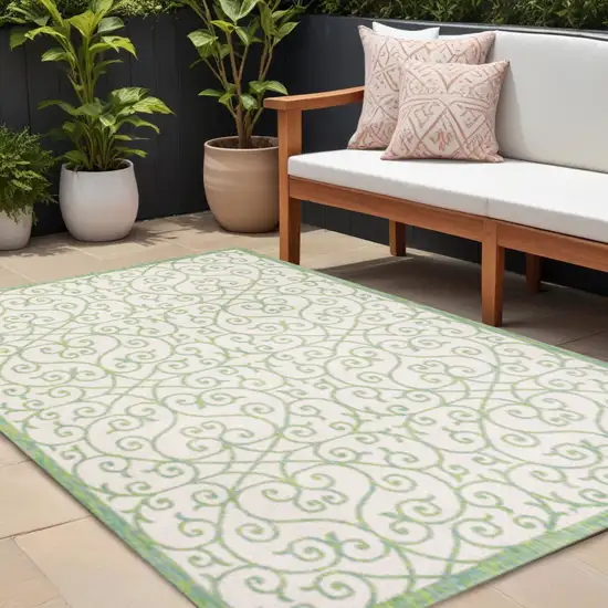 Cream And Green Geometric Indoor Outdoor Area Rug Photo 1