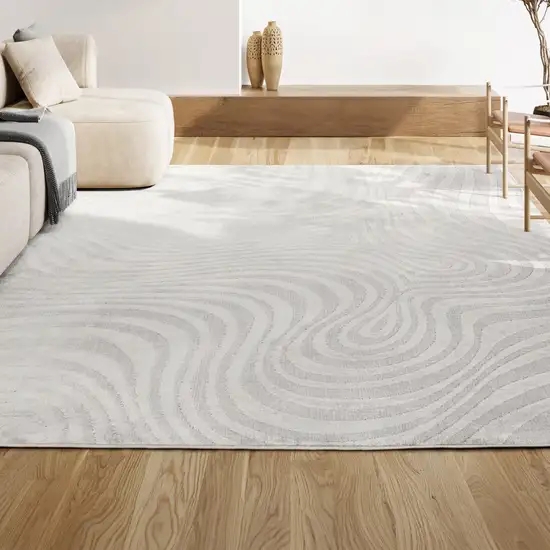 Cream And Ivory Abstract Indoor Outdoor Area Rug Photo 5