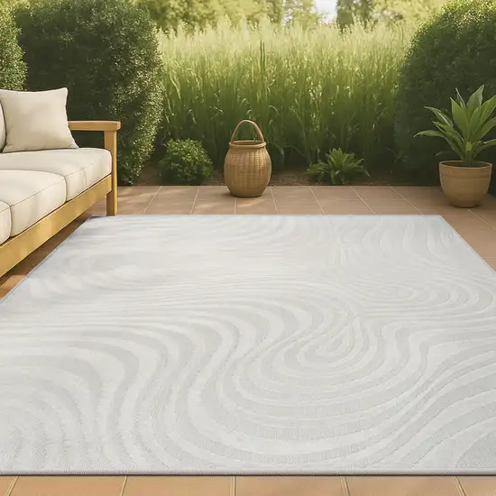 Cream And Ivory Abstract Indoor Outdoor Area Rug Photo 4