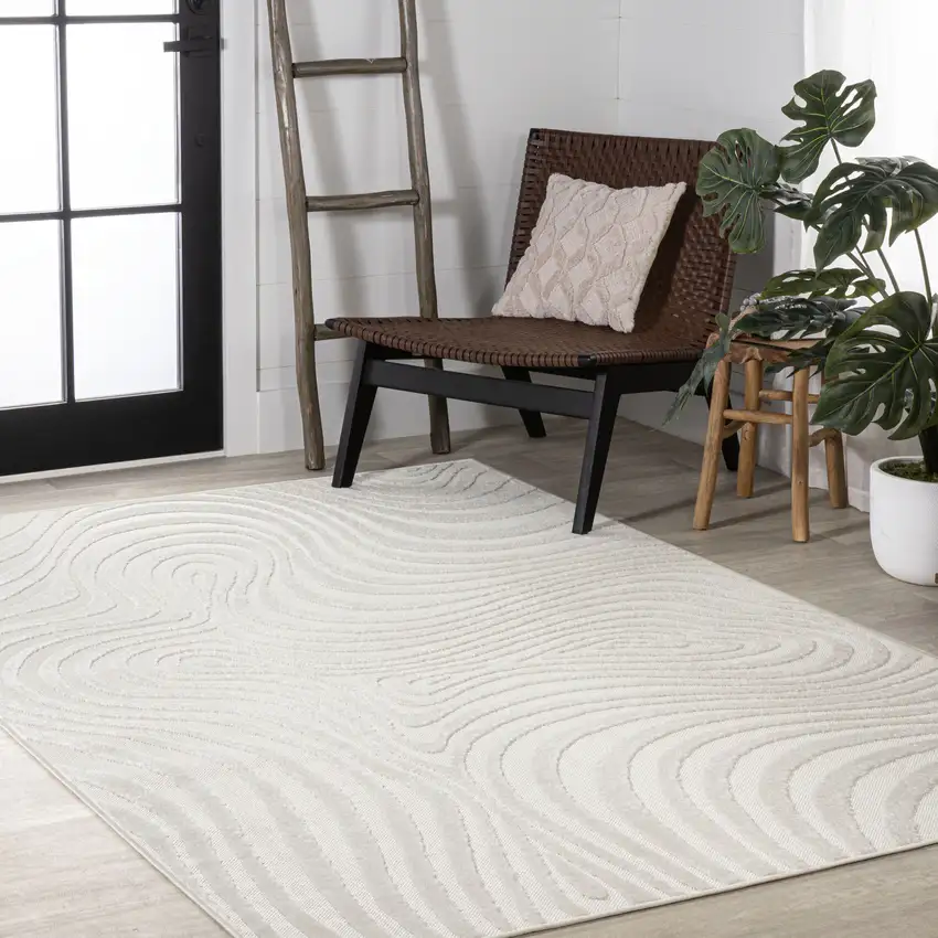 Cream And Ivory Abstract Indoor Outdoor Area Rug Photo 9