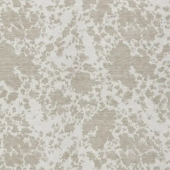 Cream And Ivory Abstract Washable Indoor Outdoor Area Rug Photo 1
