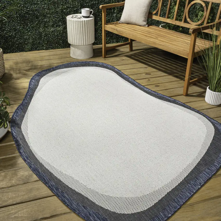 Cream And Navy Blue Abstract Indoor Outdoor Area Rug Photo 8