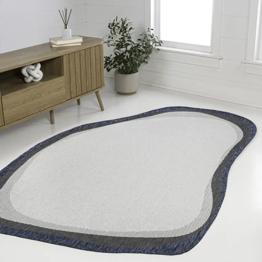 Cream And Navy Blue Abstract Indoor Outdoor Area Rug Photo 6