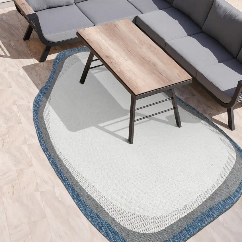 Cream And Navy Blue Abstract Indoor Outdoor Area Rug Photo 9