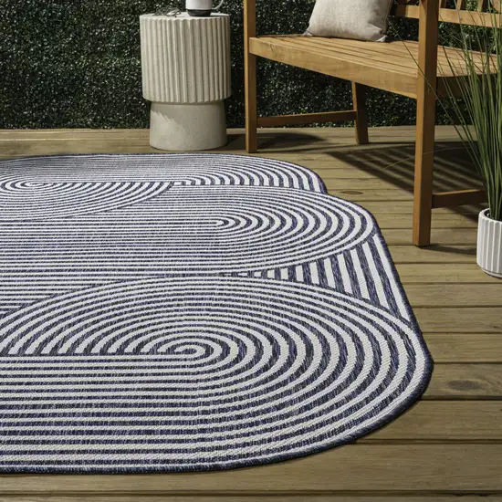 Cream And Navy Blue Abstract Indoor Outdoor Area Rug Photo 7