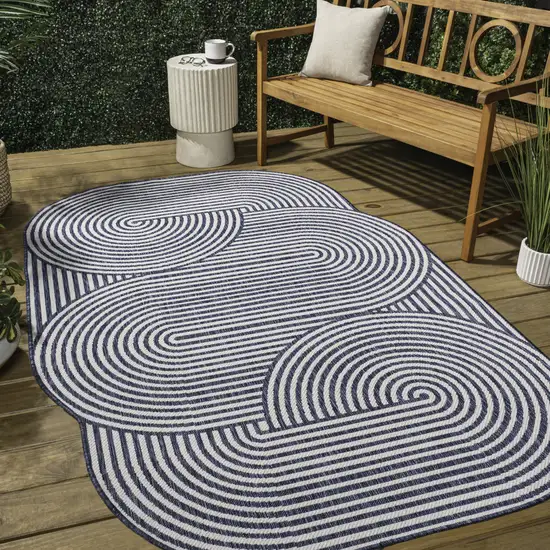 Cream And Navy Blue Abstract Indoor Outdoor Area Rug Photo 8