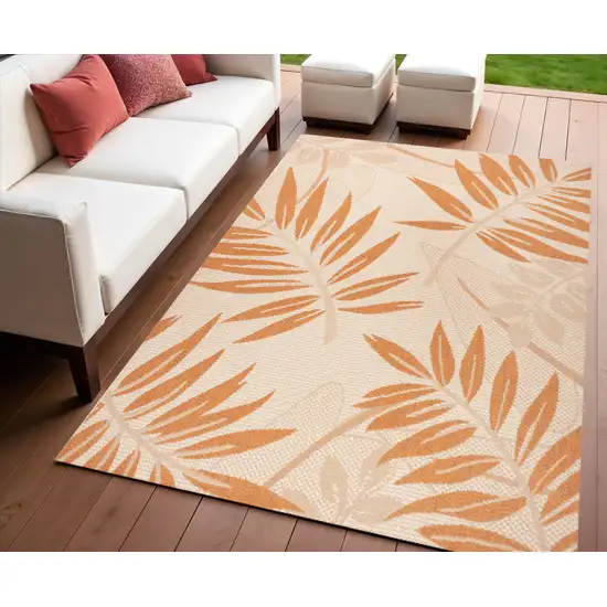 Cream And Orange Floral Indoor Outdoor Area Rug Photo 1