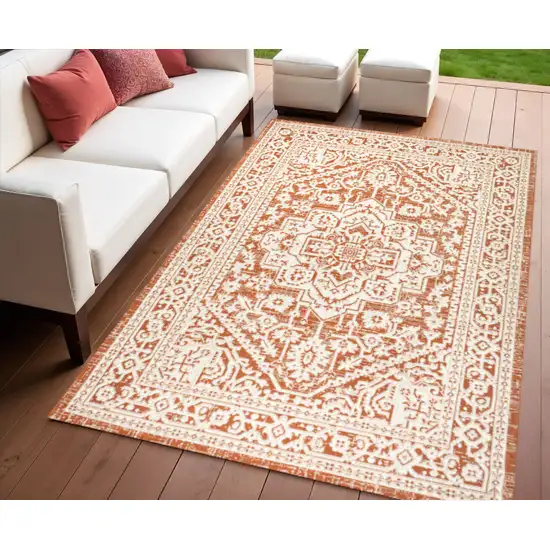Cream And Orange Geometric Indoor Outdoor Area Rug Photo 1