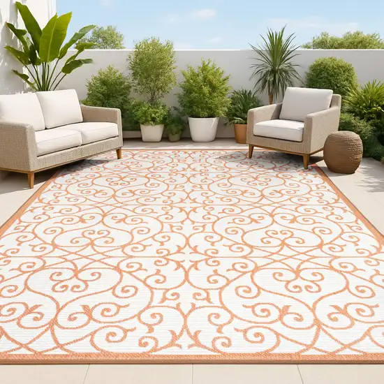 Cream And Orange Geometric Indoor Outdoor Area Rug Photo 4