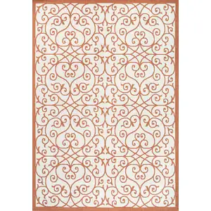 Photo of Cream And Orange Geometric Indoor Outdoor Area Rug