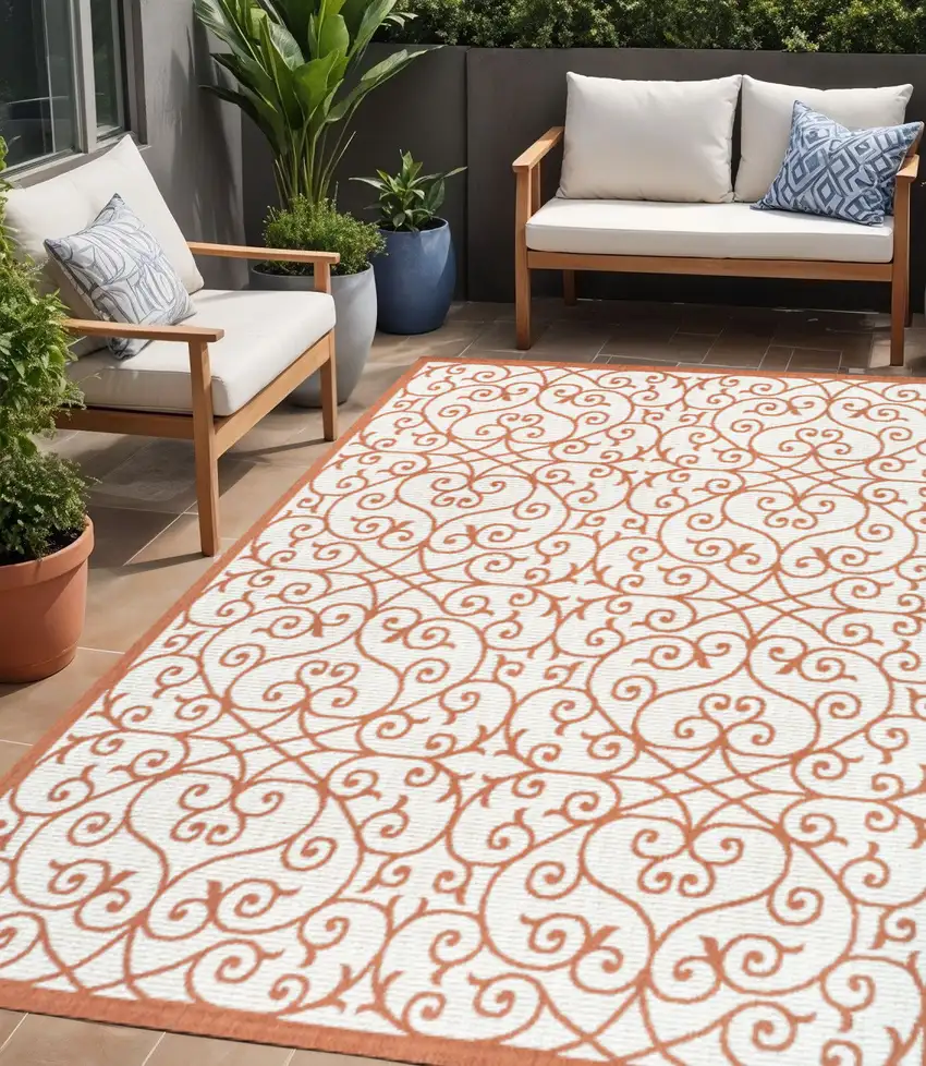 Cream And Orange Geometric Indoor Outdoor Area Rug Photo 1