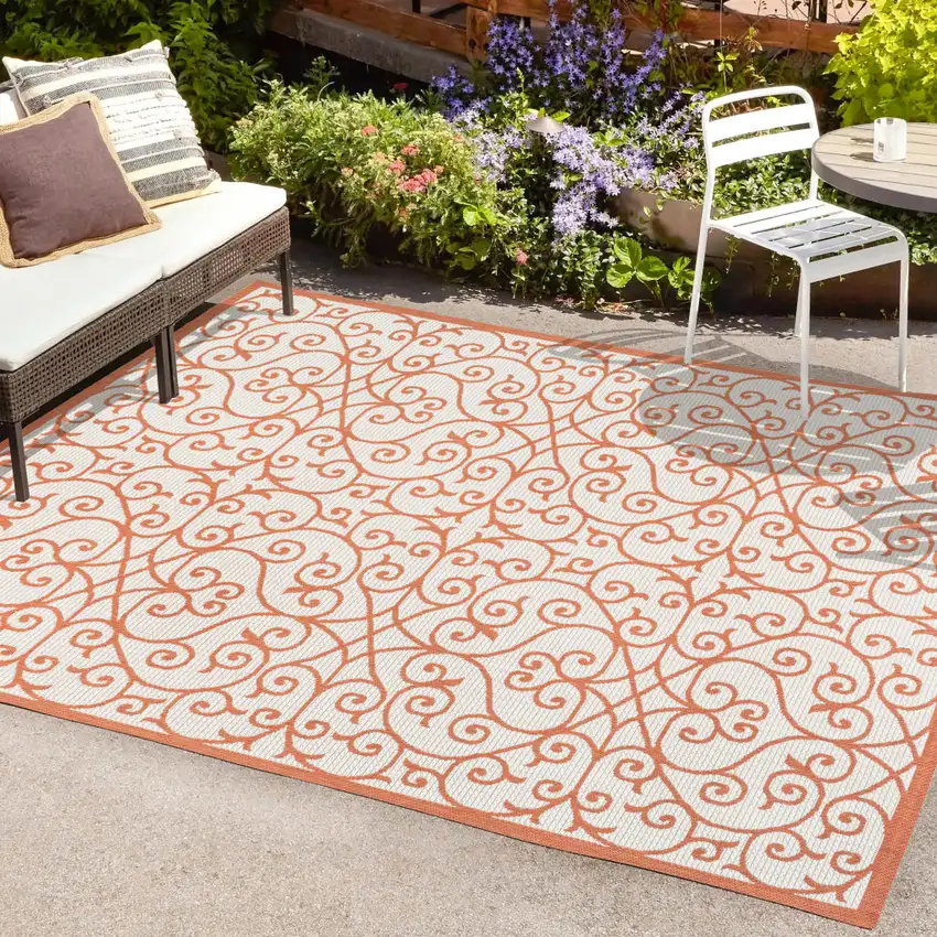 Cream And Orange Geometric Indoor Outdoor Area Rug Photo 9